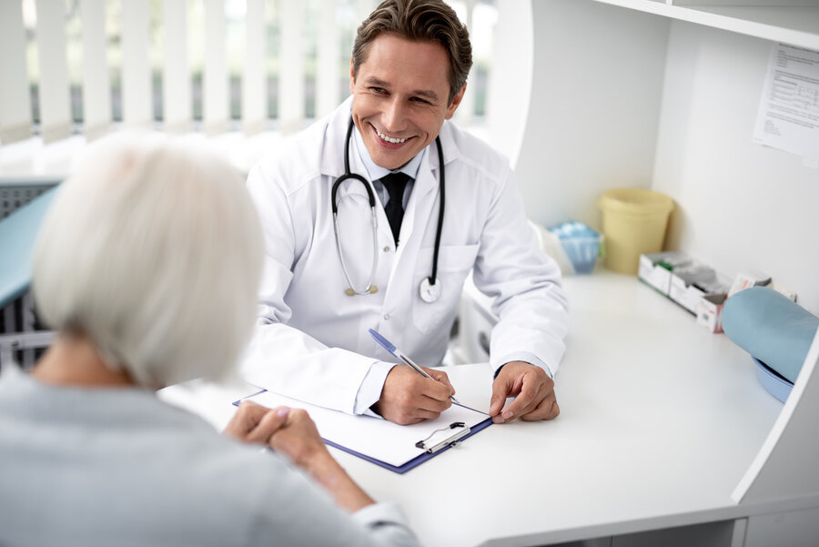 A doctor and a patient are talking in the office.